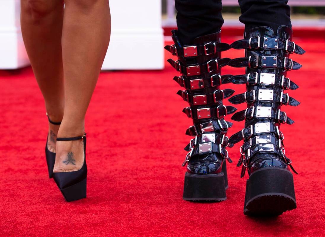 Celebrities walk the red carpet before the start of the 2022 Grammy Awards on Sunday, April 3, ...