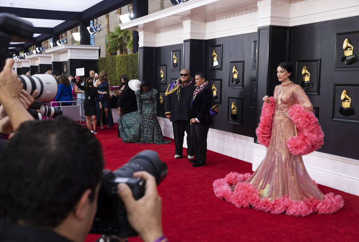 St. Vincent, right, on the red carpet before the start of the 2022 Grammy Awards on Sunday, Apr ...