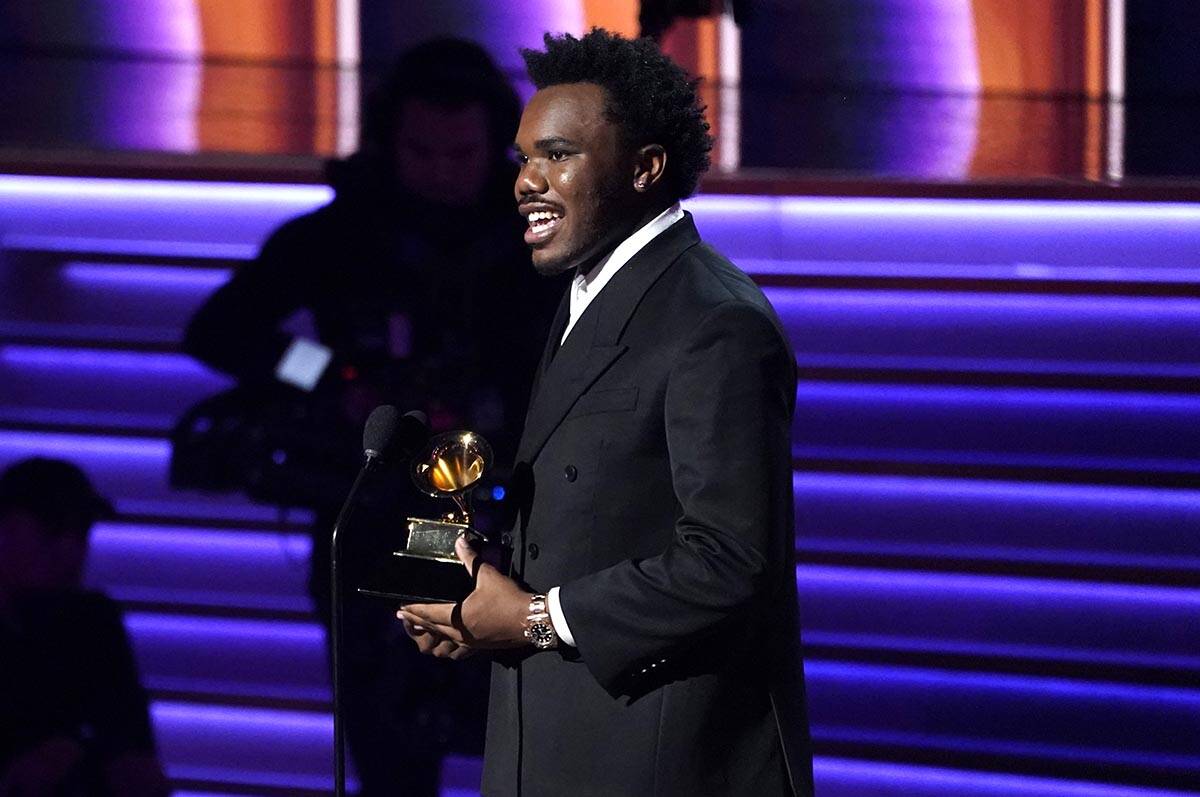 Baby Keem accepts the award for best rap performance for "Family Ties" at the 64th An ...
