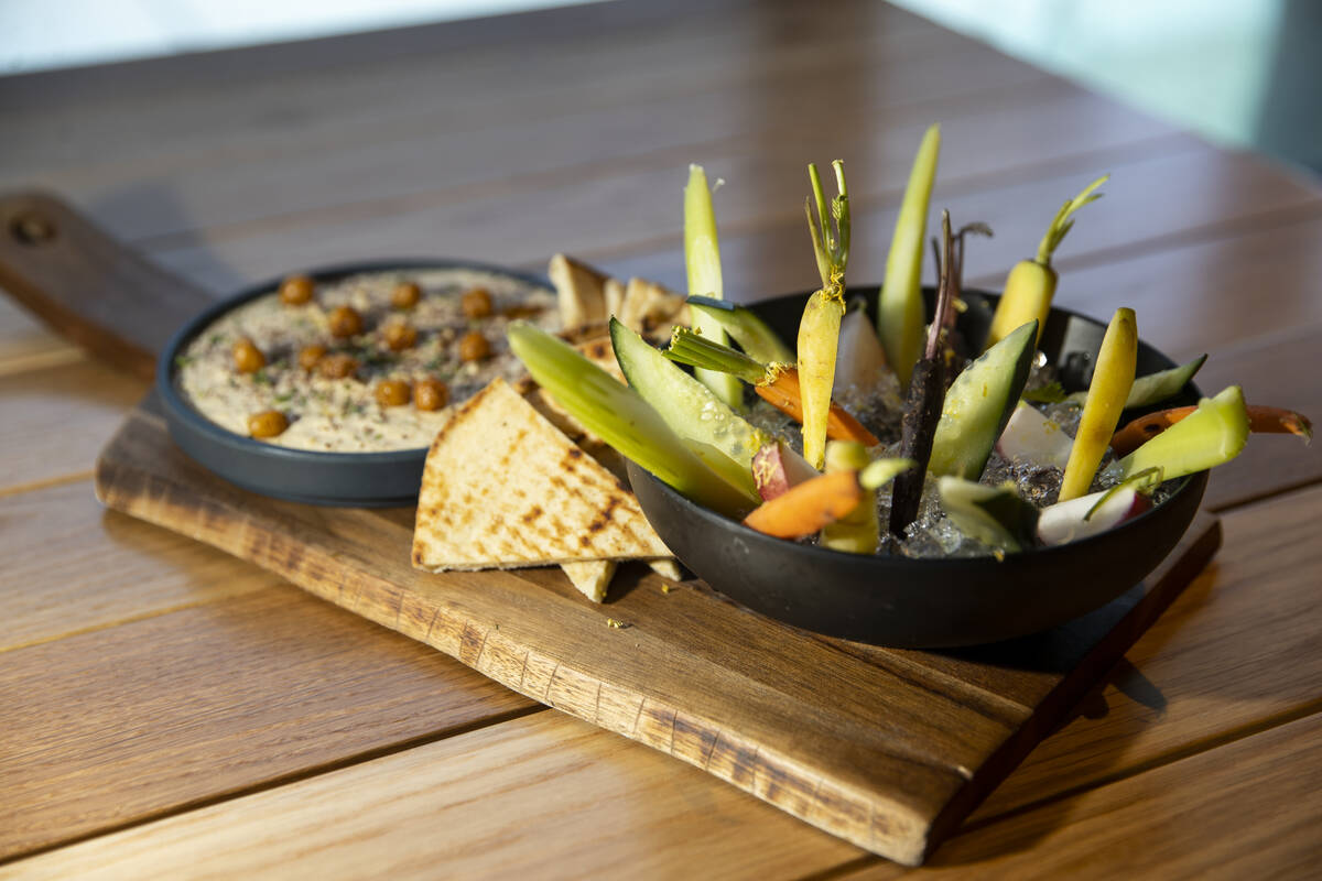 The chickpea hummus with grilled naan at Lumin Cafe inside of the Illuminarium Experiences ente ...