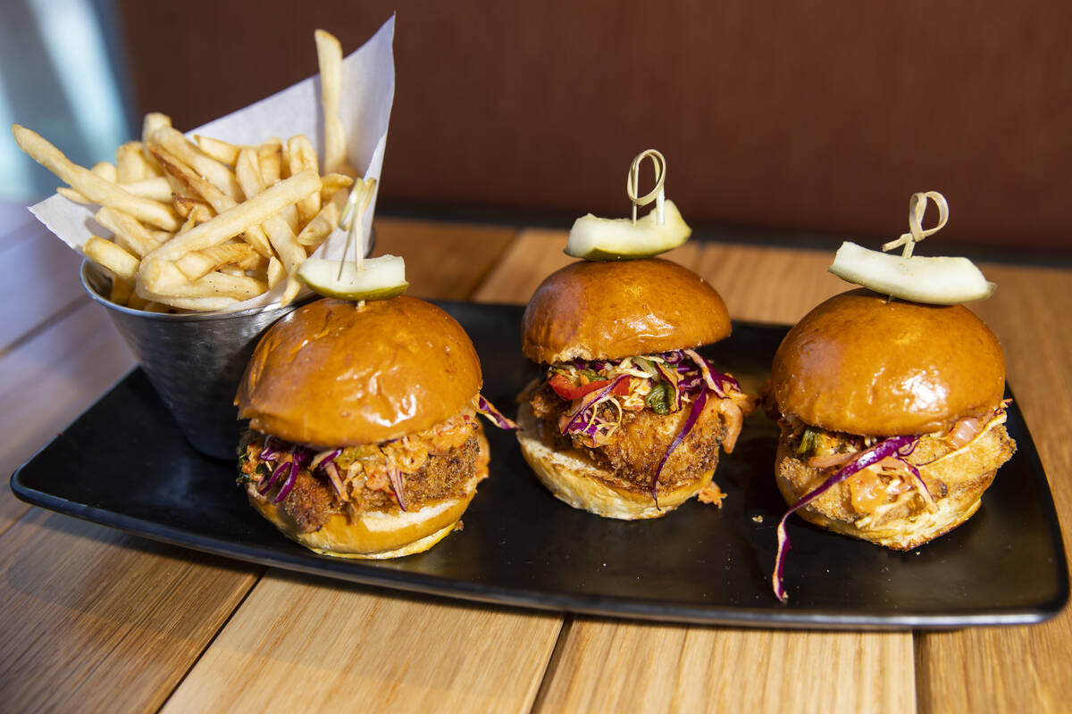 The fried chicken sliders served with kimchi slaw, pickles and sriracha aioli at Lumin Cafe ins ...