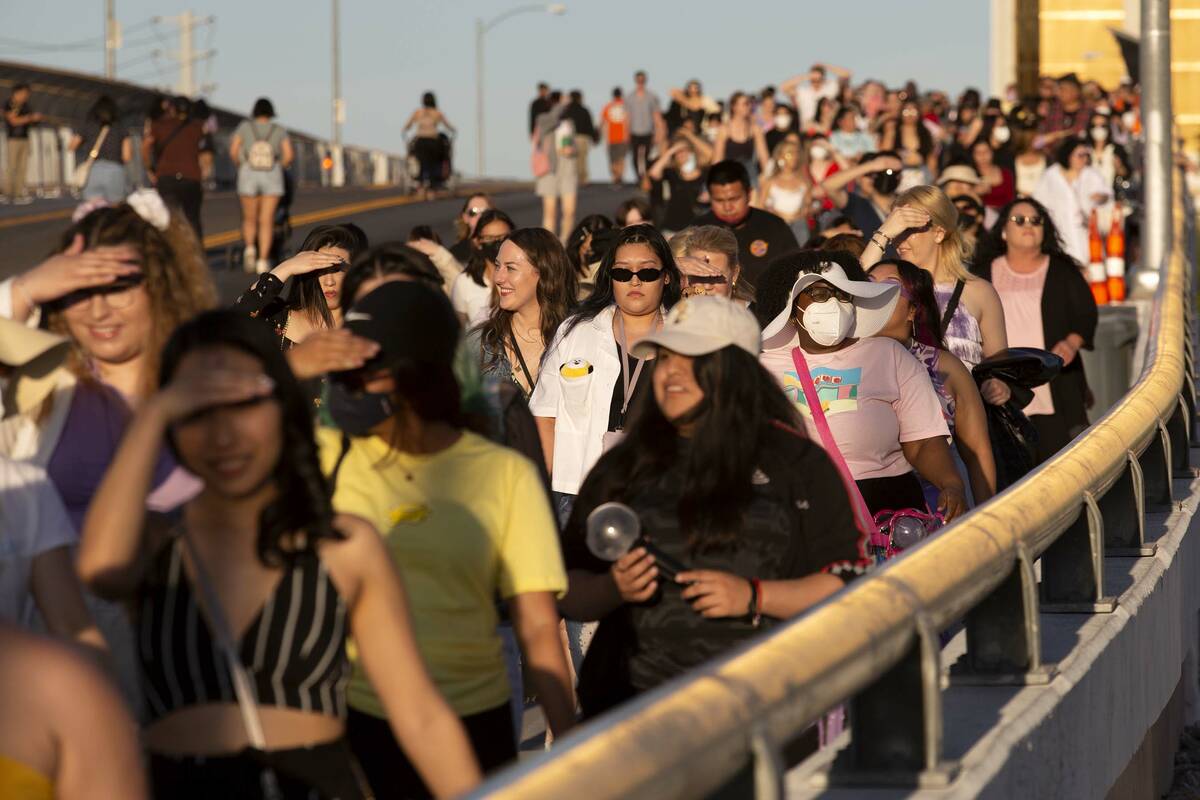 BTS fans, known as the “BTS Army” online, cross West Hacienda Avenue toward Alleg ...