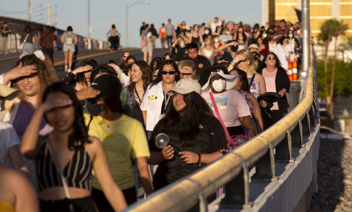 BTS fans, known as the “BTS Army” online, cross West Hacienda Avenue toward Alleg ...