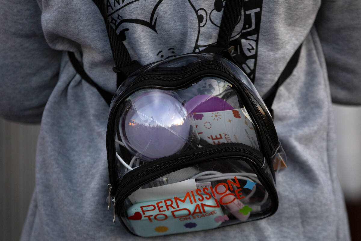 A BTS fan wears the Korean boy band’s merchandise while waiting in line to enter their s ...