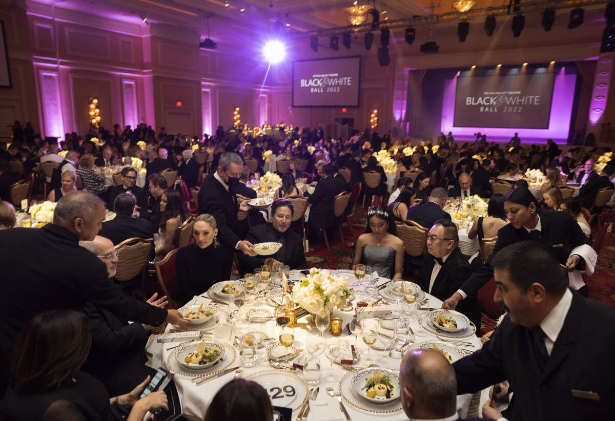 Guests are served dinner during Nevada Ballet Theatre’s 38th Annual Black & White Ba ...