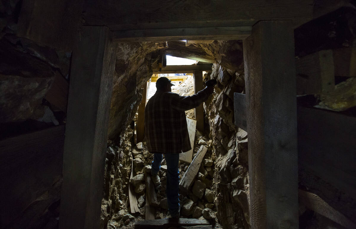 Caden Gould of Genoa searches through an old mine in search of vintage denim and other antiquit ...