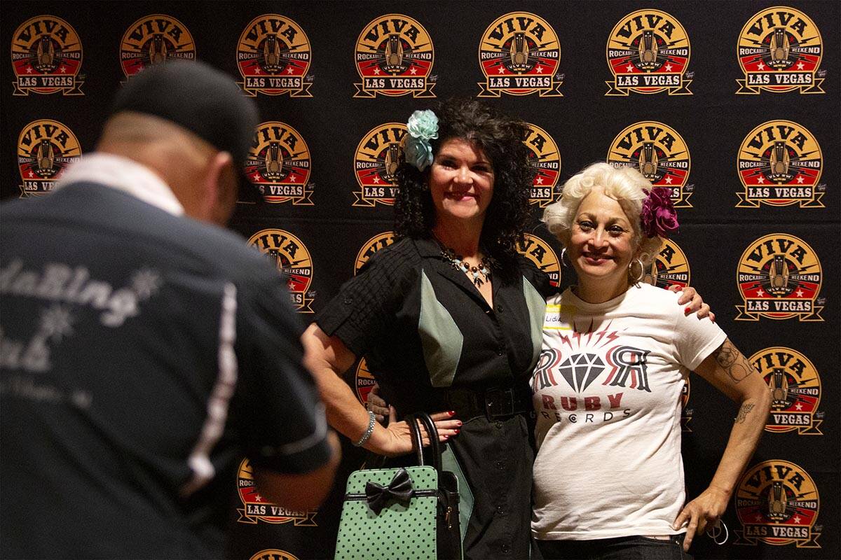 Raymond Roberts, of Sacramento, photographs Judia Jackson, of Washington, center, and Lidia Rio ...
