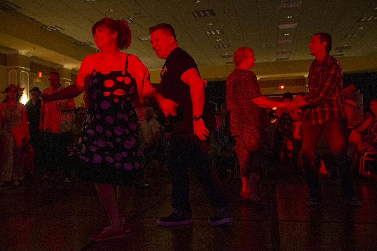 Sally Janssens, left, and Gerry Laureys, second from left, of Belgium, swing dance during Shand ...