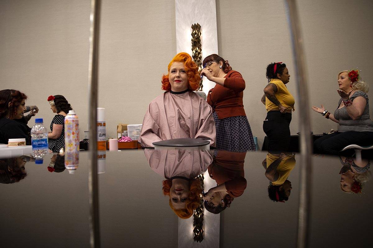 Sarah Webb, center, of London, England, has her hair done by Becca Anne at the Atomic Style Lou ...
