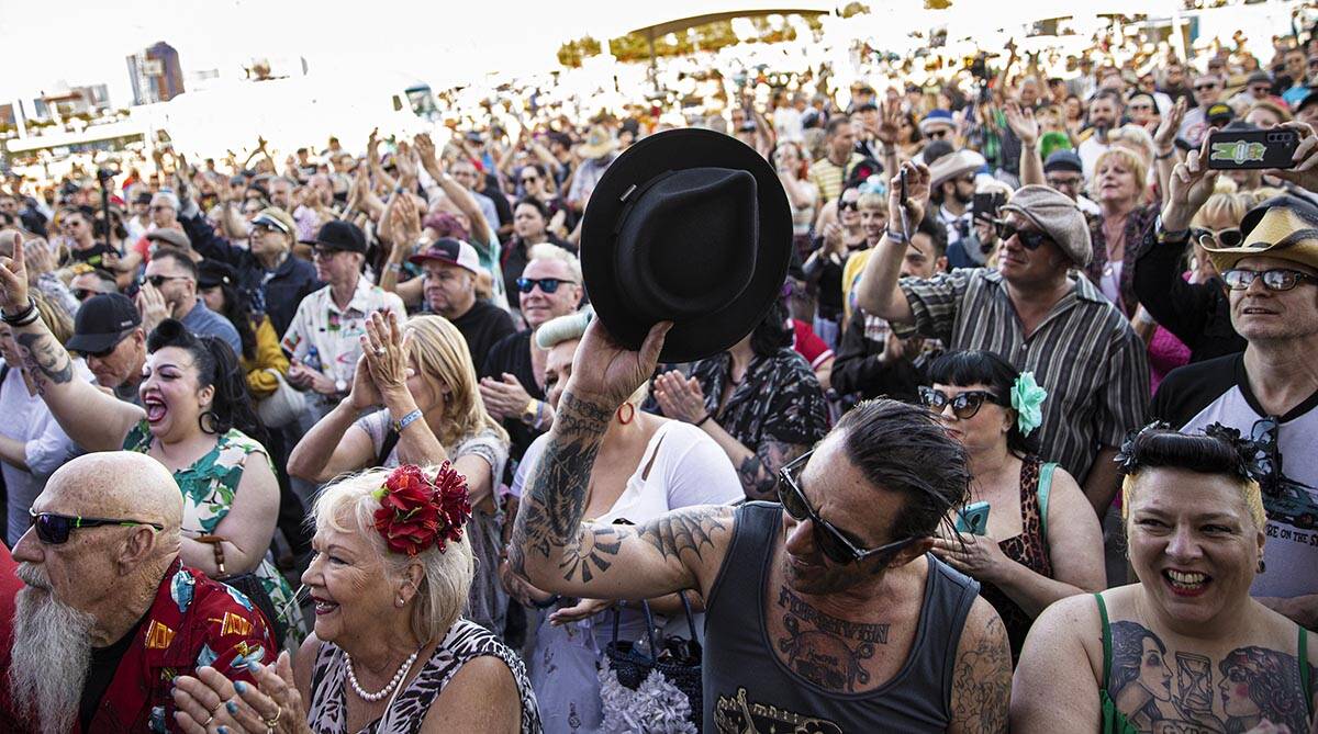 Attendees listen to Big Sandy & His Fly-Rite Boys during the Rockabilly Car Show at Viva La ...
