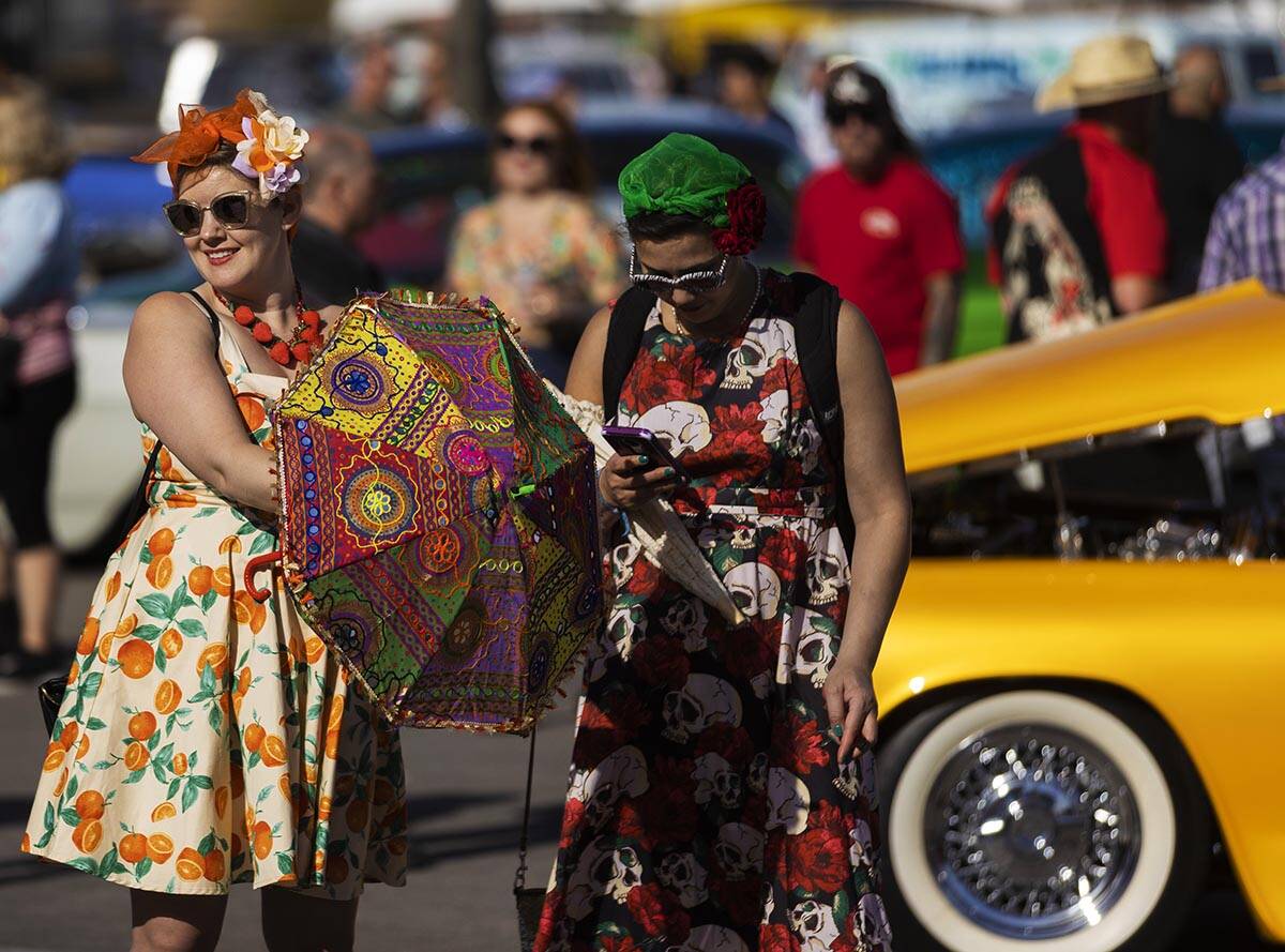 Attendees socialize during the Rockabilly Car Show at Viva Las Vegas Rockabilly Weekend on Satu ...