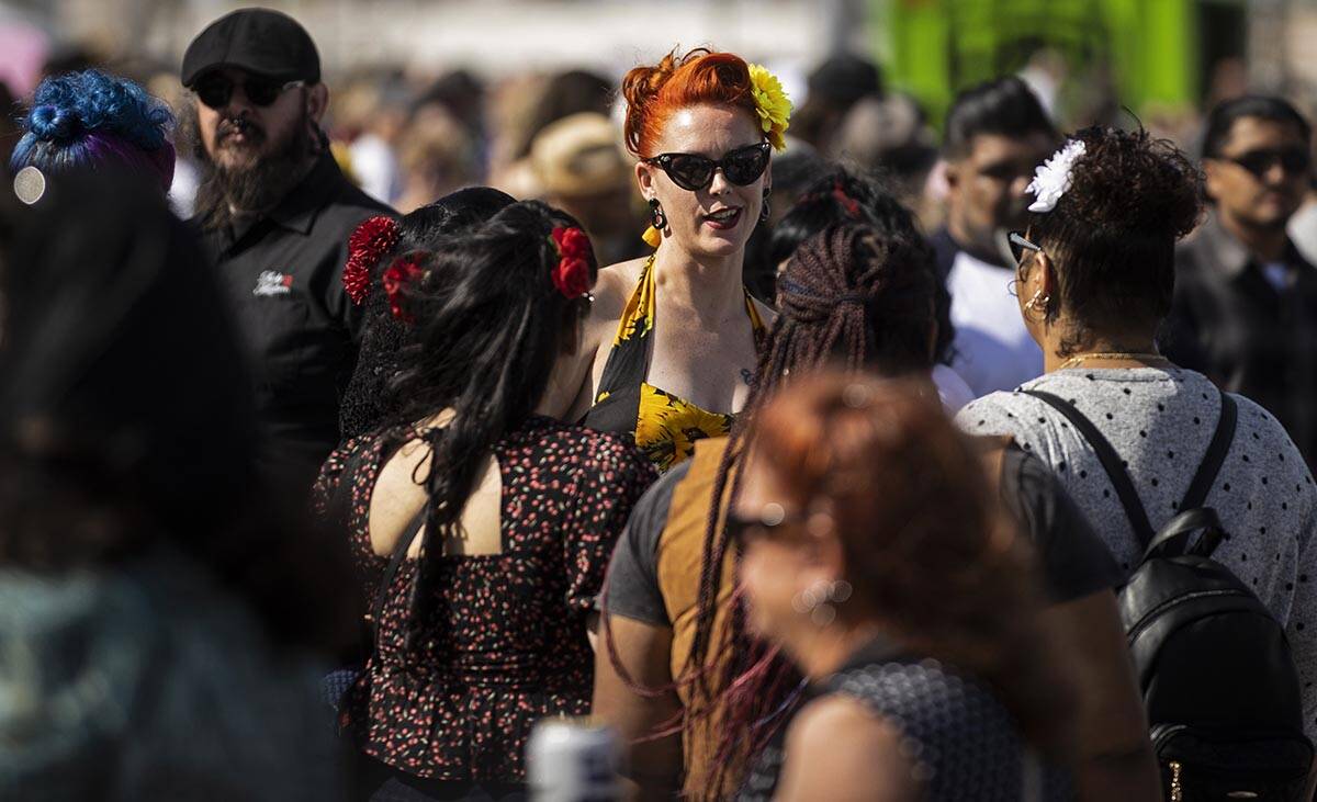 Attendees socialize during the Rockabilly Car Show at Viva Las Vegas Rockabilly Weekend on Satu ...
