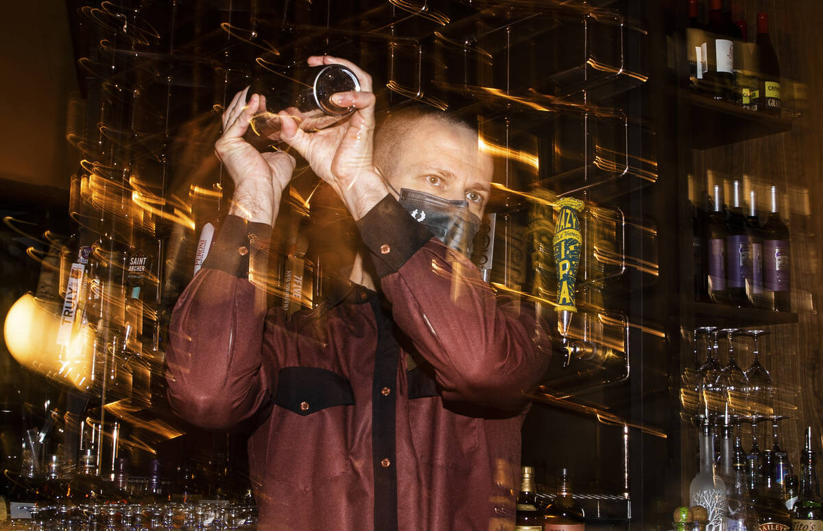 Bartender Davor Vekic makes a cocktail during the grand opening of Stadia Bar at Caesars Palace ...