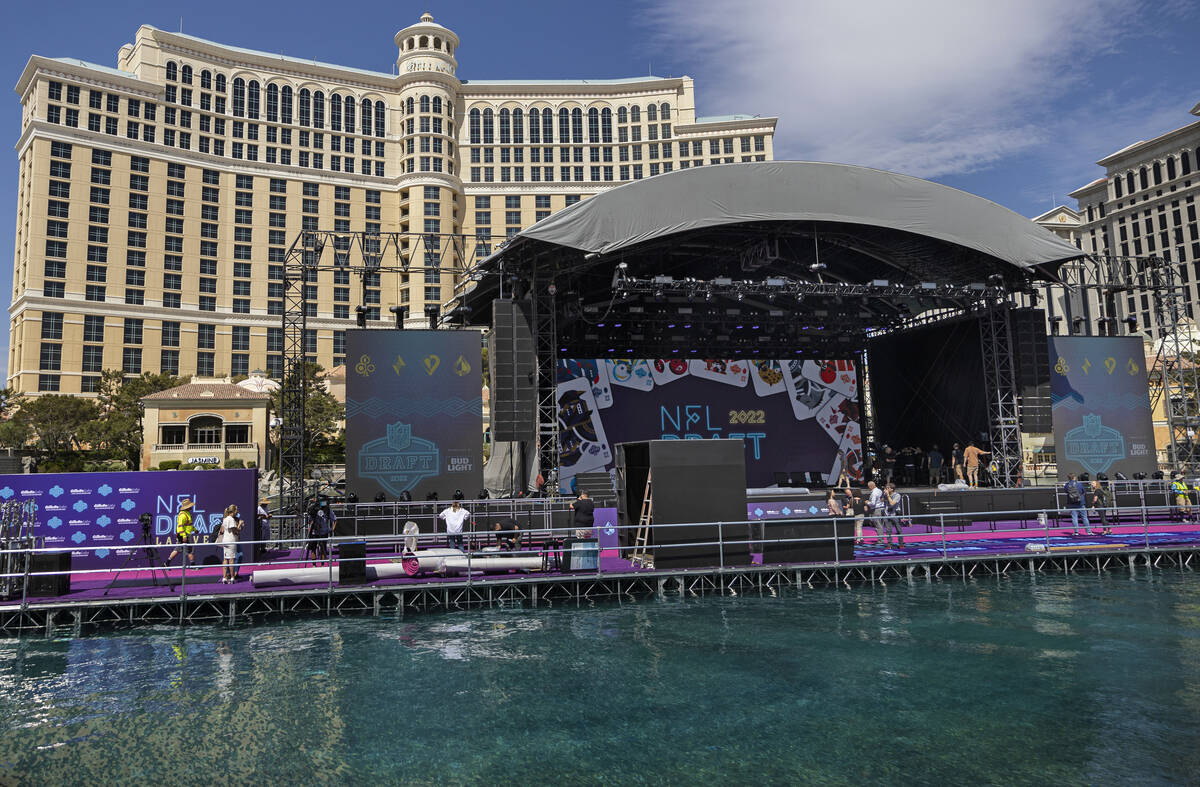 Workers continue to build the NFL draft red carpet stage at the Bellagio Fountains on Tuesday, ...