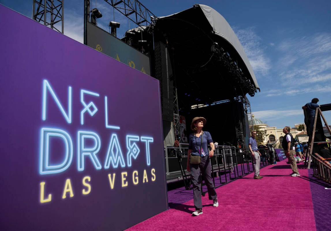 Workers continue to build the NFL draft red carpet stage at the Bellagio Fountains on Tuesday, ...
