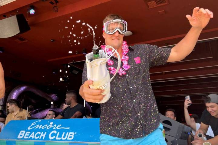 Rob Gronkowski sprays sparkling wine on the crowd during Gronk Beach party at Encore Beach Club ...