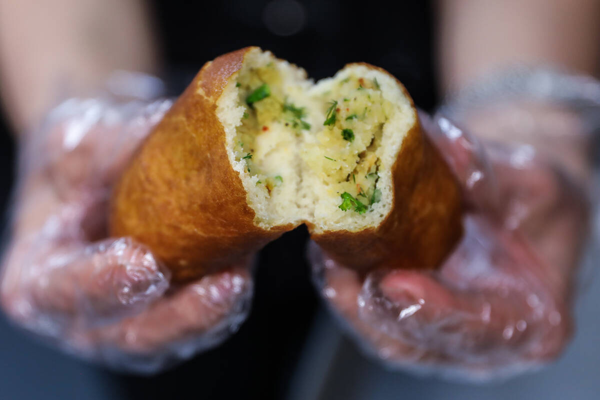 Asmik Yetaryan holds open a perashki at Van Bakery in Las Vegas, in Las Vegas, Thursday, April ...