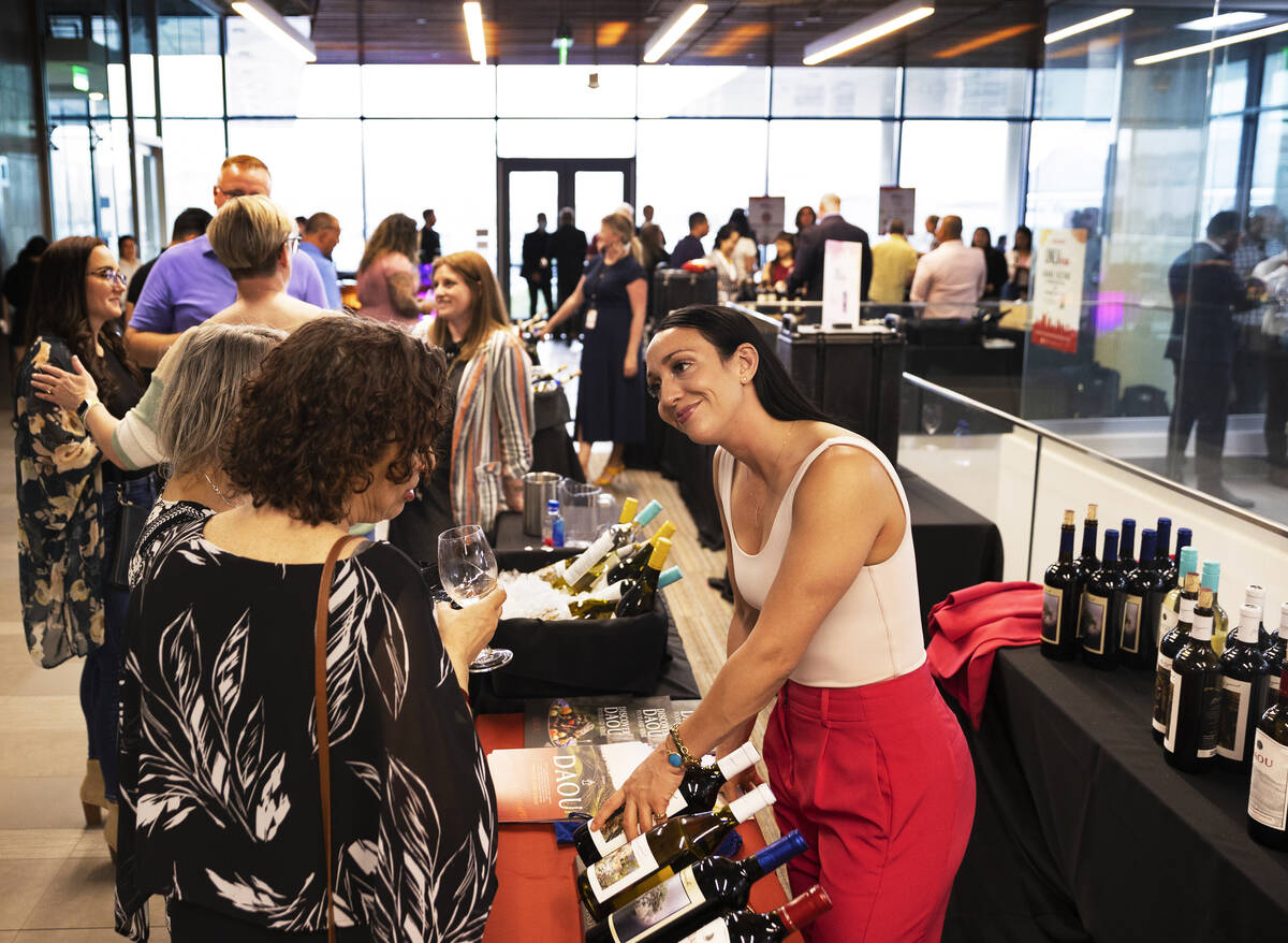 Jessica Olmstead, right, business development manager with DAOU Vineyards, discusses wine choic ...