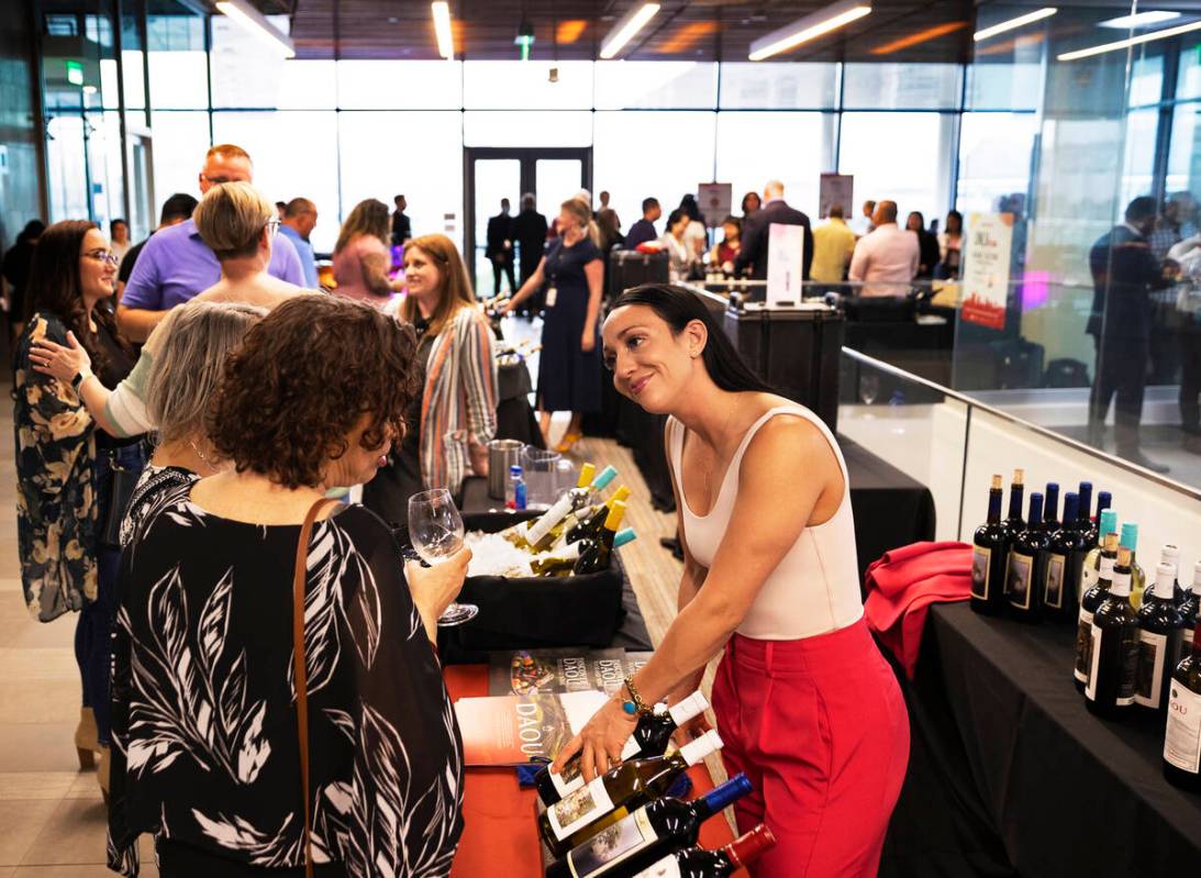 Jessica Olmstead, right, business development manager with DAOU Vineyards, discusses wine choic ...
