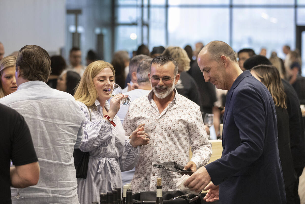 Guests enjoy wine tasting at UNLVino on Saturday, May 7, 2022, at UNLV College of Hospitality, ...
