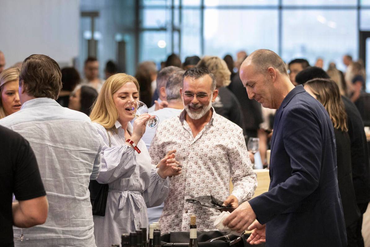 Guests enjoy wine tasting at UNLVino on Saturday, May 7, 2022, at UNLV College of Hospitality, ...