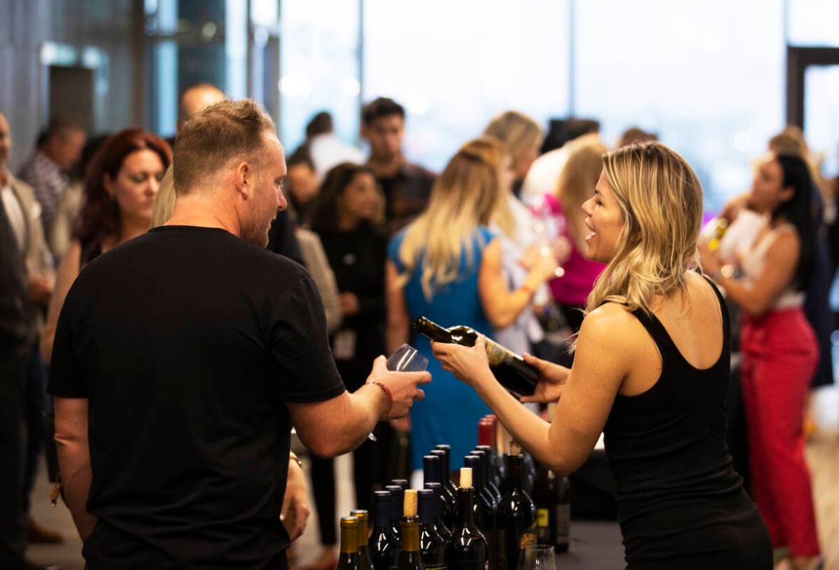 Guests enjoy wine tasting at UNLVino on Saturday, May 7, 2022, at UNLV College of Hospitality, ...