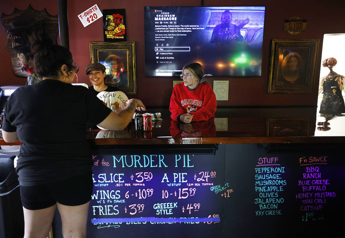 Sliced Pizza co-owner Nina Sakoulas, center, talks with her customer at her shop, Sunday, May 8 ...