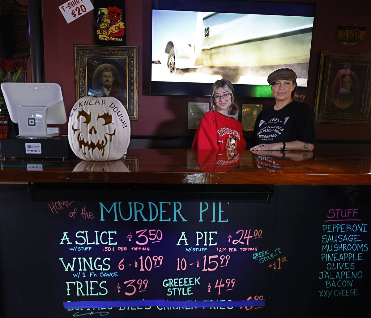 Sliced Pizza co-owner Nina Sakoulas, right, and her daughter Lola Blue, 13, pose for a photo at ...