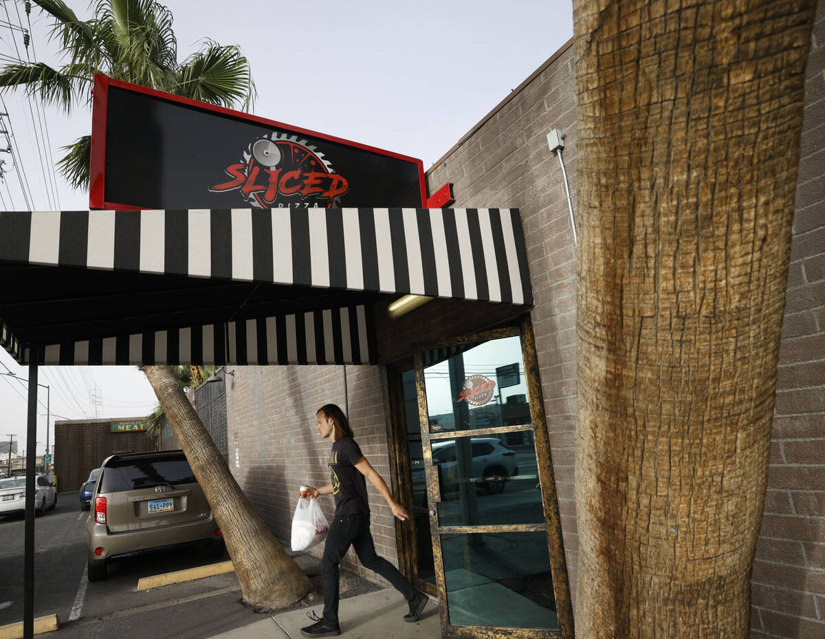 A customer comes out from Sliced Pizza, Sunday, May 8, 2022, in Las Vegas. (Chitose Suzuki / La ...