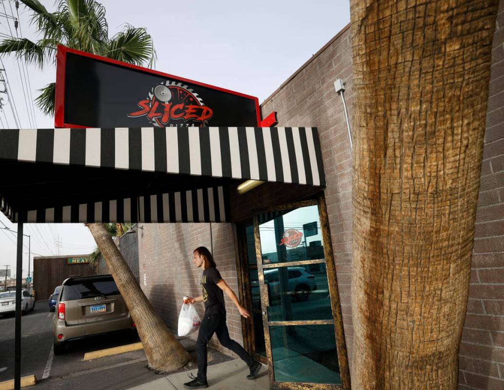 A customer comes out from Sliced Pizza, Sunday, May 8, 2022, in Las Vegas. (Chitose Suzuki / La ...
