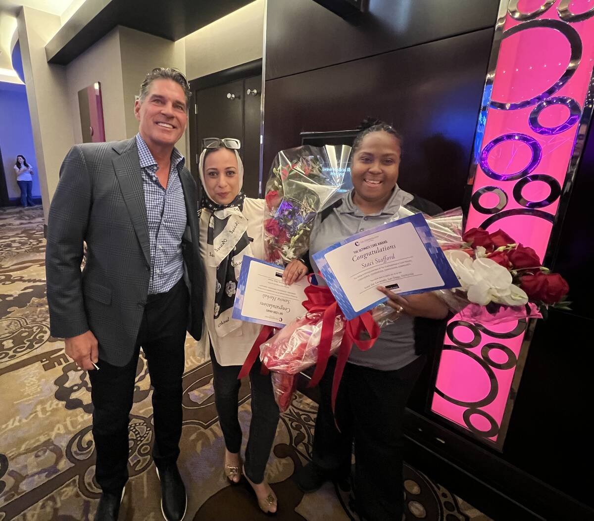 Cosmopolitan President and CEO Bill McBeath is shown with longtime employees Samira Harbali and ...