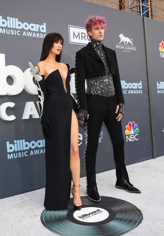 Megan Fox and Machine Gun Kelly pose on the red carpet for the Billboard Music Awards at the MG ...
