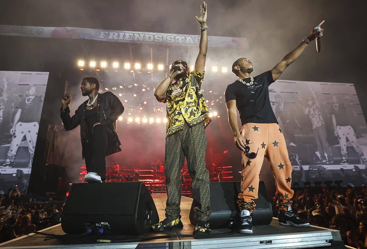 Usher, from left, Lil Jon, and Ludacris performs during the Lovers & Friends music festival ...