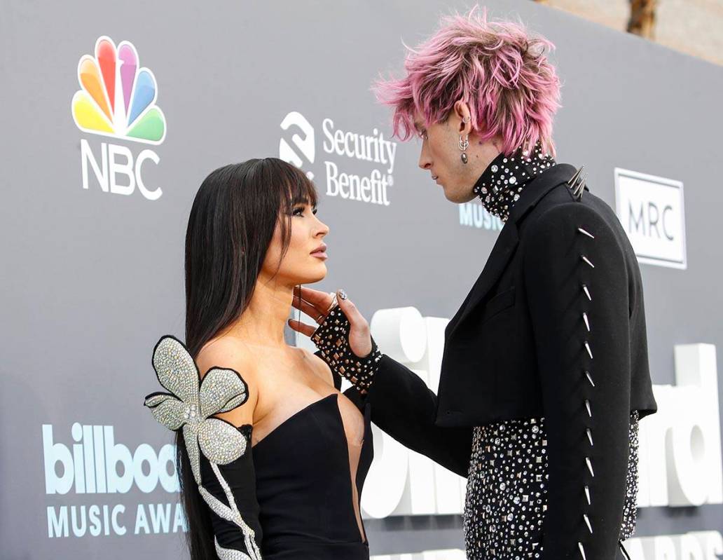 Megan Fox and Machine Gun Kelly pause on the red carpet for the Billboard Music Awards at the M ...