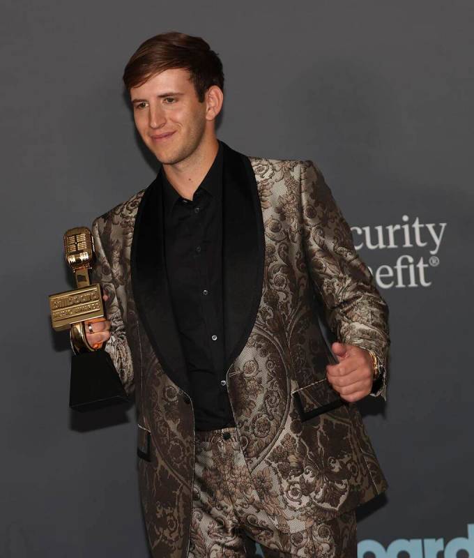 DJ Illenium poses with the “Top Dance/Electronic Album” award in the backstage press room d ...