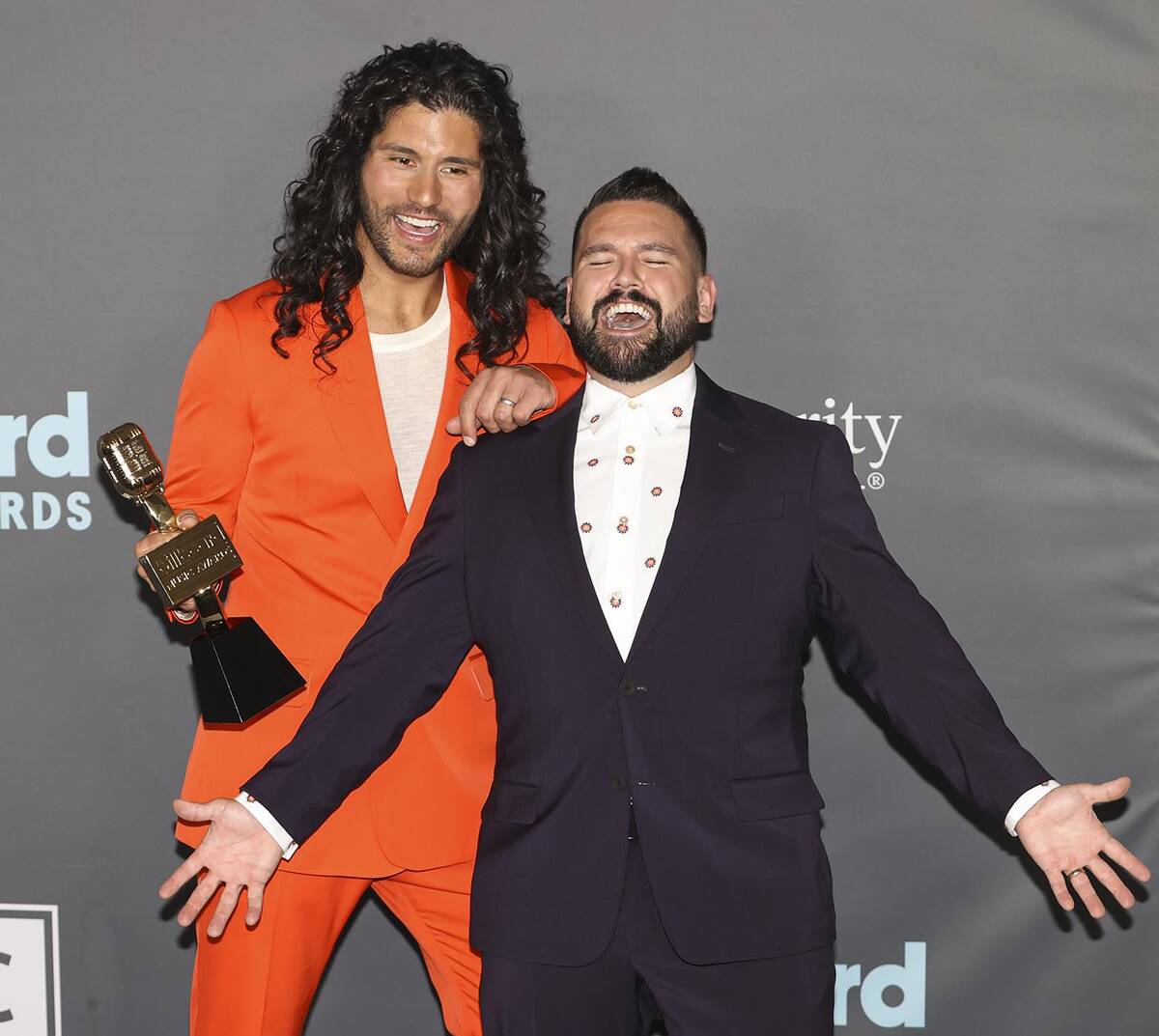 Dan Smyers, left, and Shay Mooney, of duo Dan + Shay, pose with the award for “Top Country Du ...