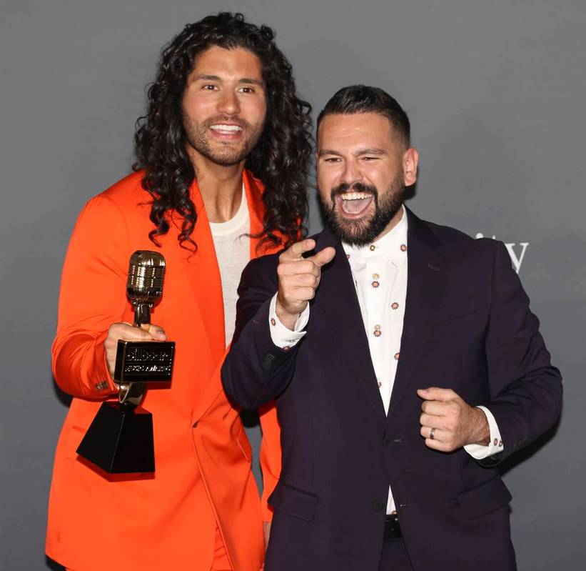 Dan Smyers, left, and Shay Mooney, of duo Dan + Shay, pose with the award for “Top Country Du ...