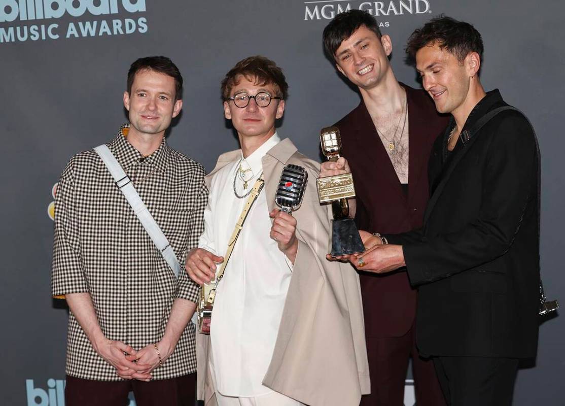 Members of Glass Animals pose with the "Top Rock Artist” award in the backstage press room du ...