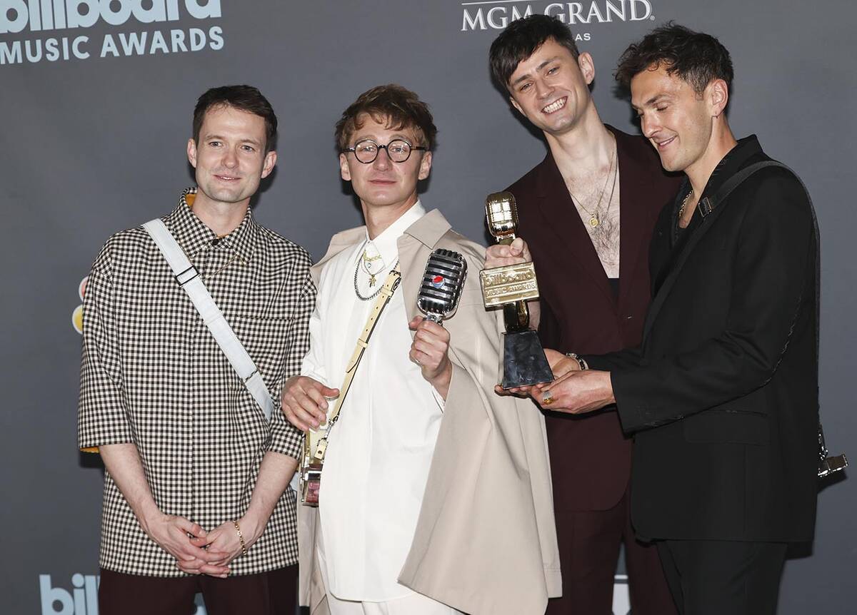 Members of Glass Animals pose with the "Top Rock Artist” award in the backstage press room du ...