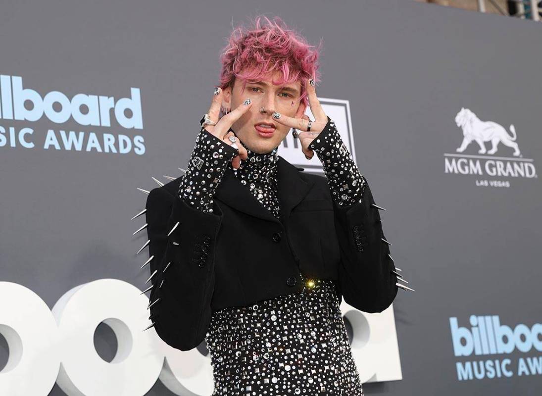 Machine Gun Kelly poses on the red carpet for the Billboard Music Awards at the MGM Grand Garde ...