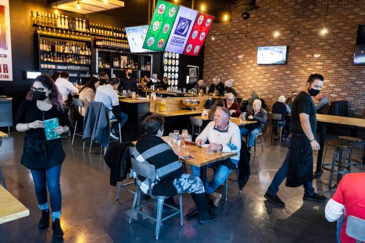 Guests enjoy dinner at El Luchador Mexcian Kitchen + Cantina on Friday, March 12, 2021, in Las ...