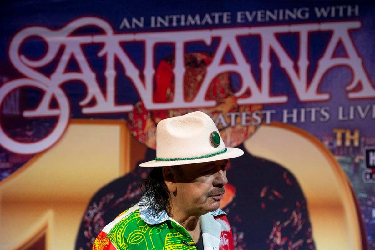 Carlos Santana talks to reporters during a press conference to announce an extension of Santana ...
