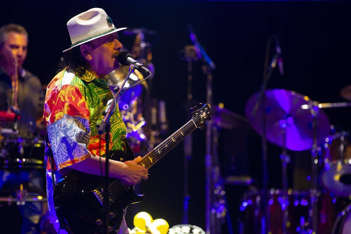 Carlos Santana performs a sound check after a press conference to announce an extension of Sant ...