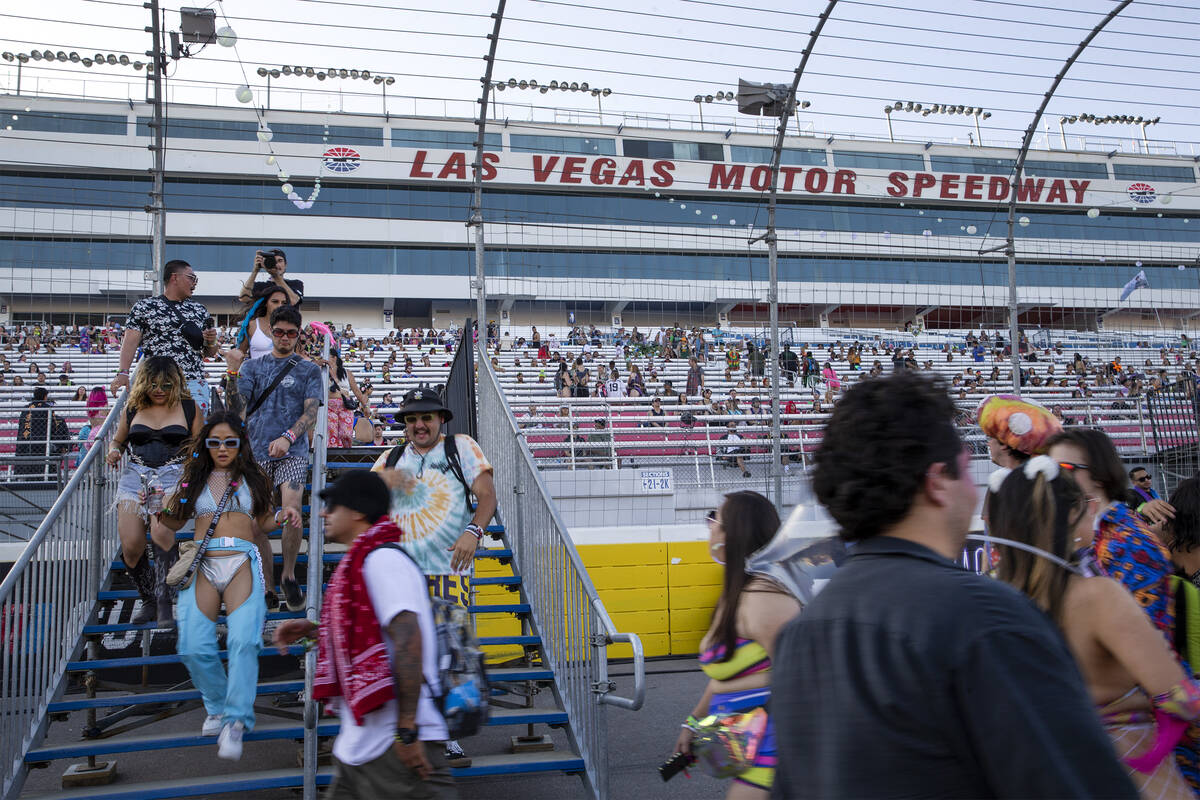 Attendees dance as they enter festival grounds during the first day of the Electric Daisy Carni ...