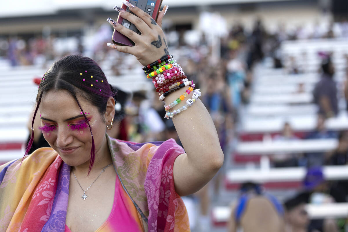 One attendee dances as they enter the festival grounds during the first day of the Electric Dai ...