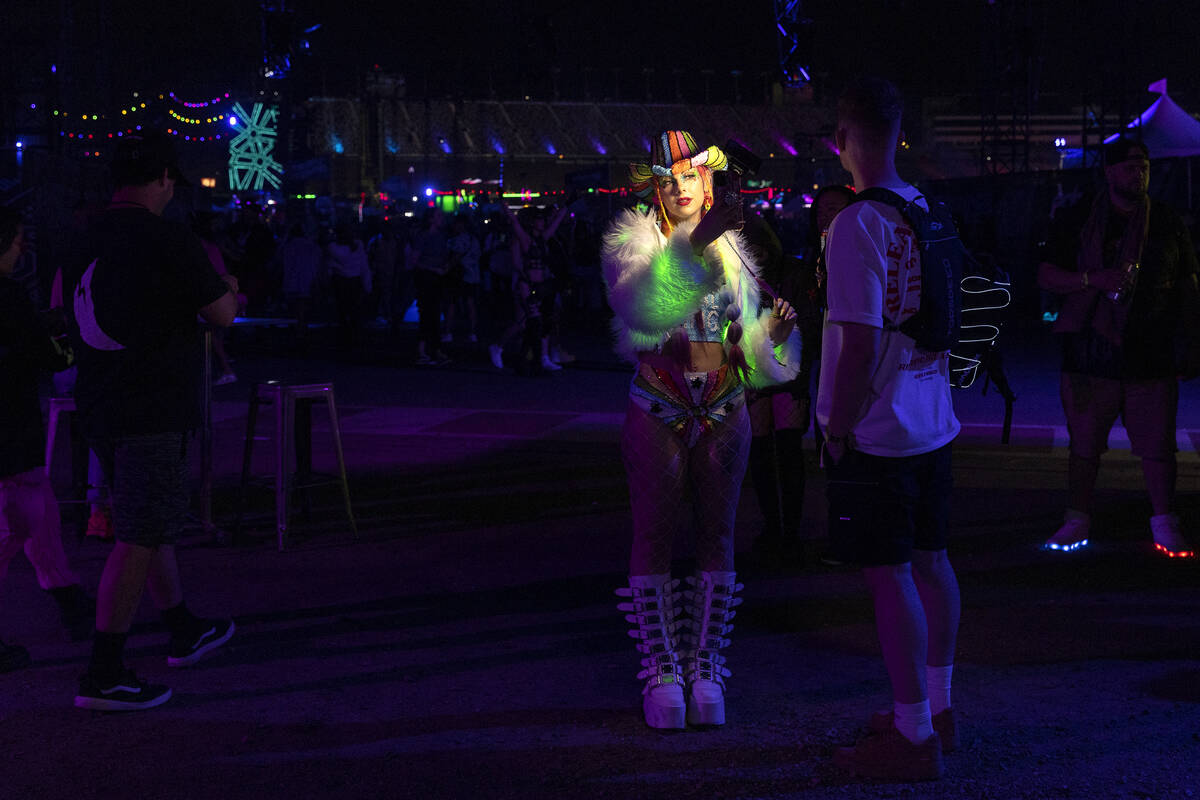Sophie Hannah, of London, England, takes a selfie during the first day of the Electric Daisy Ca ...