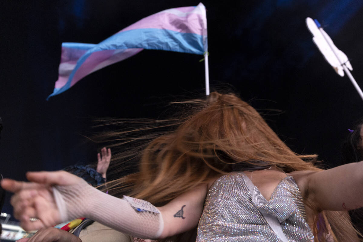 A front-row fan sways to Grimes’ DJ set during the second day of the Electric Daisy Carn ...
