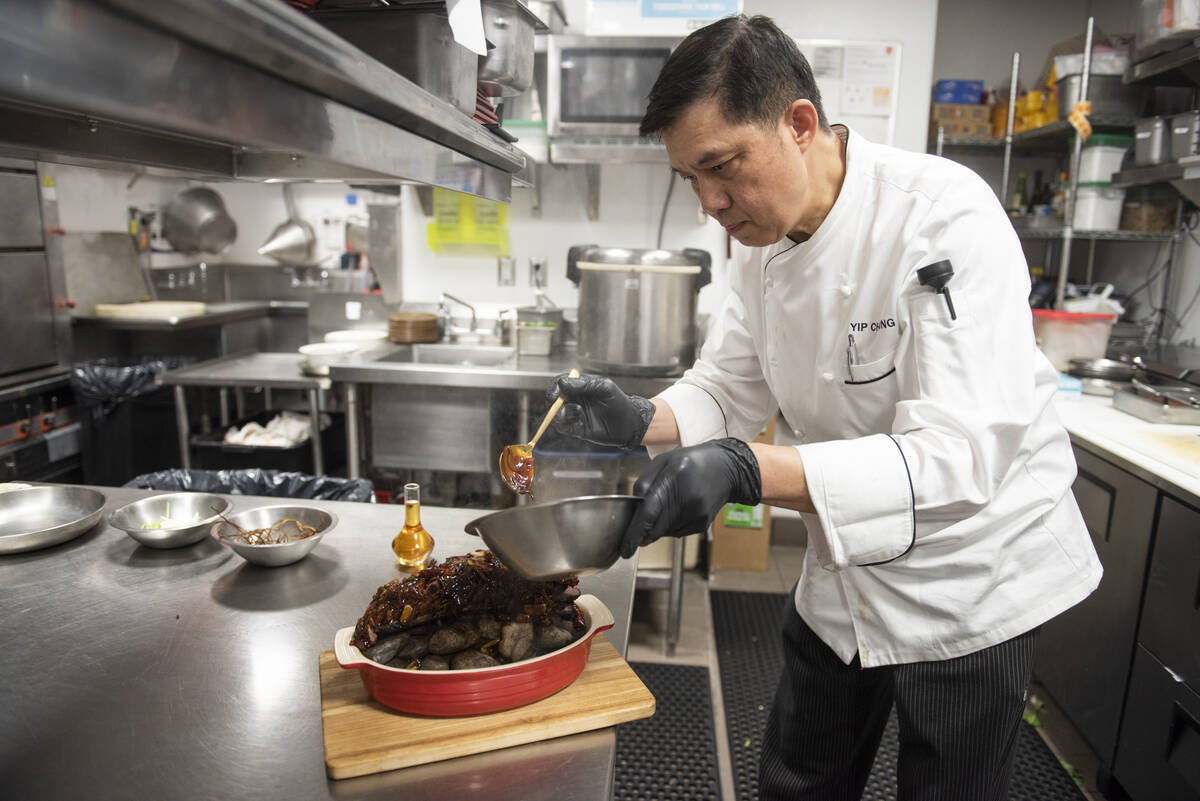 Chef Yip Cheung prepares the Chef's Special Short Rib Served on Ishiyaki Sizzling Stones at Red ...
