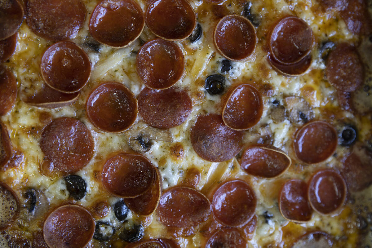 A pepperoni pizza awaits boxing at Izzy’s Pizza Bus outside Vegas Valley Winery on Satur ...