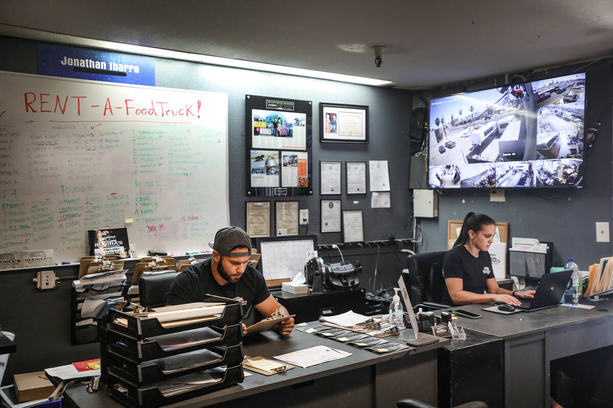 Jonathan Ibarra, left, co-owner of Ibarra’s, a food truck building and renting business, ...